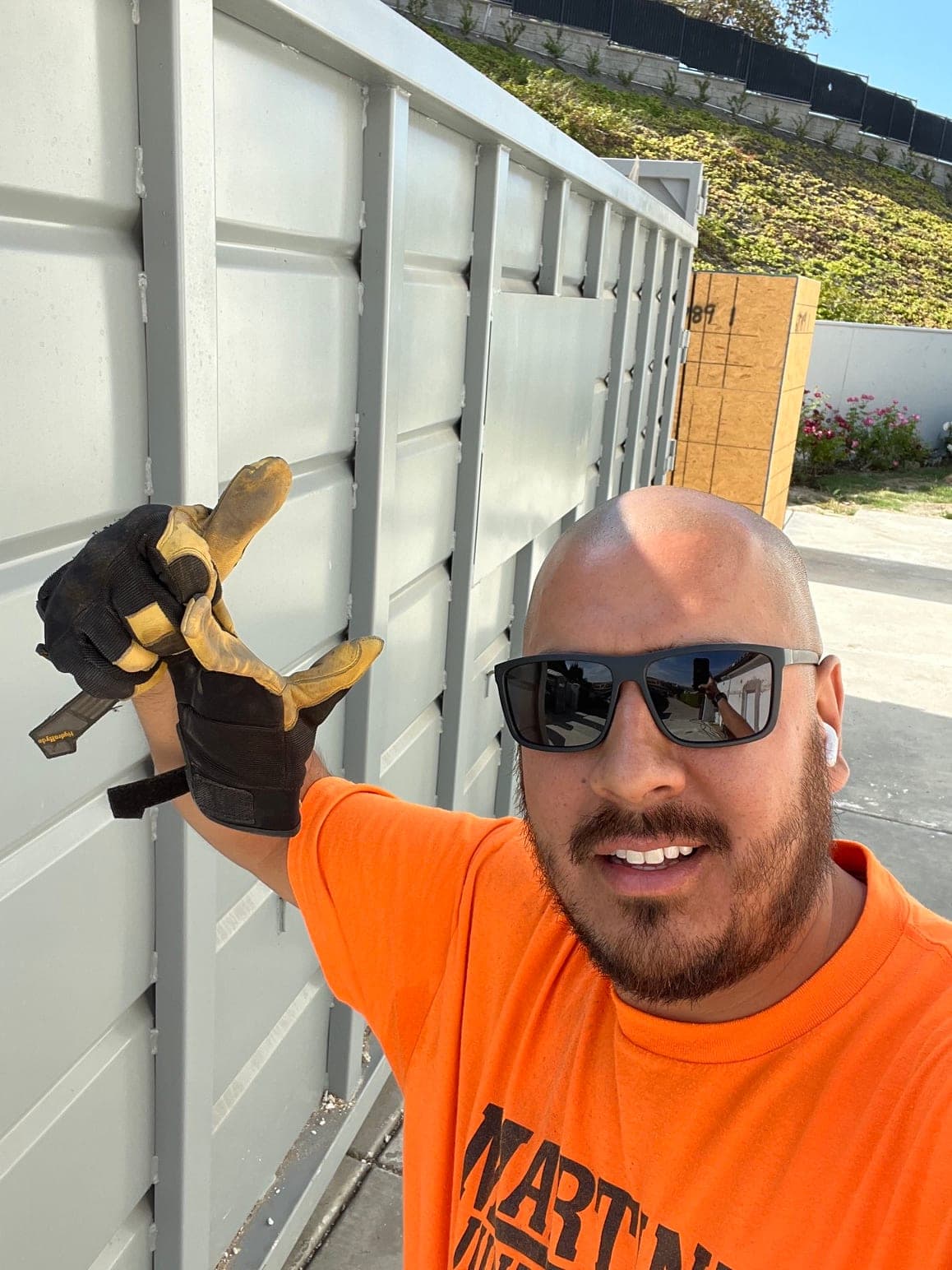 Mario Martinez, owner of Martinez Junk Removal, giving a thumbs-up on a job site.